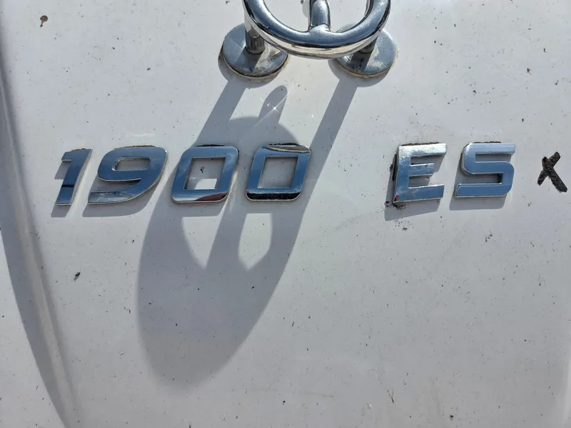 Slide: The Image of Chrome "1900 ES" emblem on a 2017 Regal Bowrider boat. - 10