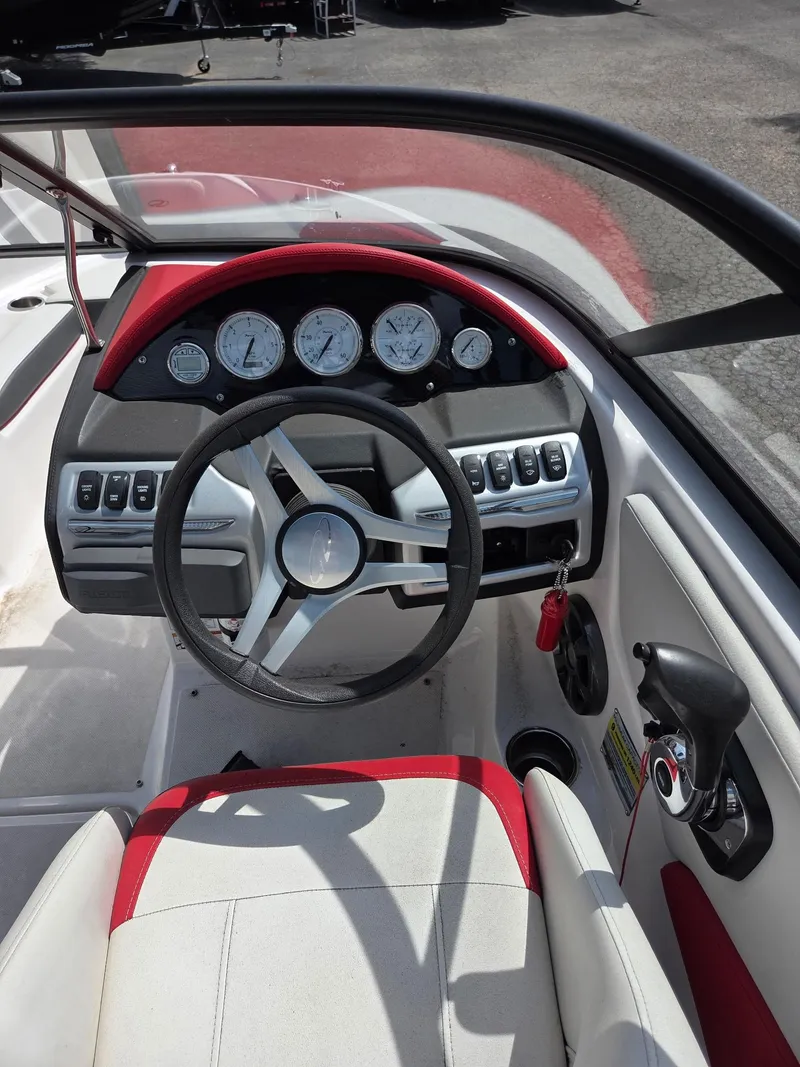 Slide: The Image of 2017 Regal 1900 ES Bowrider dashboard with steering wheel and gauges. - 4