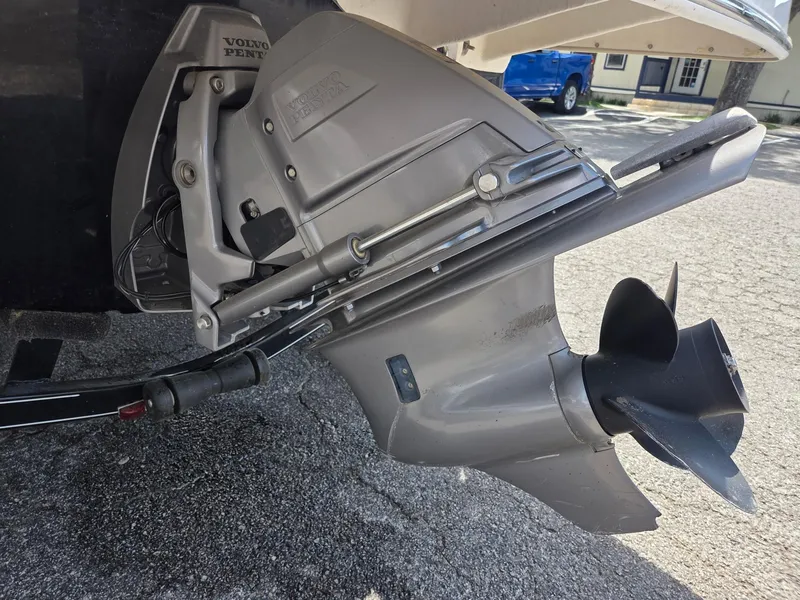 Slide: The Image of 2017 Regal 1900 ES Bowrider boat's Volvo Penta outdrive on pavement. - 7