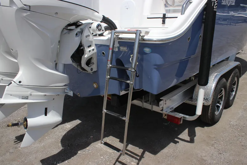 Slide: The Image of 2025 Sea Fox 268 Commander boat with ladder and dual outboard motors on trailer. - 10