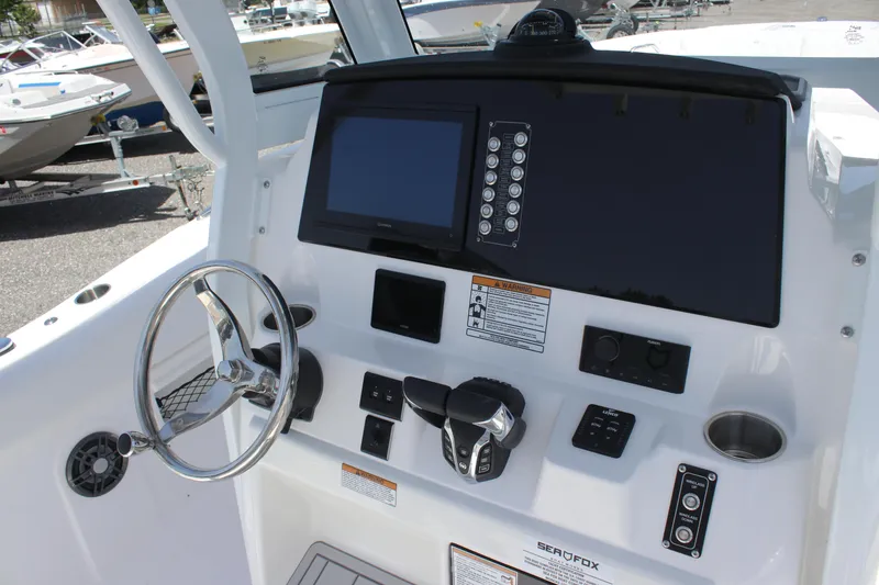 Slide: The Image of 2025 Sea Fox 268 Commander dashboard with steering wheel and control panel. - 14