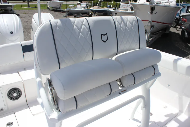 Slide: The Image of 2025 Sea Fox 268 Commander boat seating with white quilted upholstery and sleek design. - 15