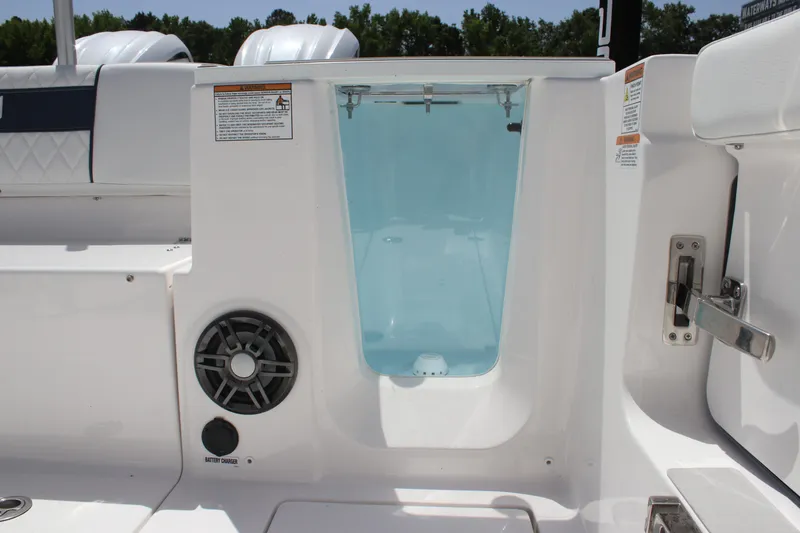 Slide: The Image of 2025 Sea Fox 268 Commander boat interior with speaker and storage compartment. - 19