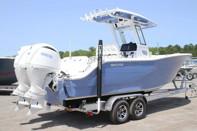 Slide: The Image of 2025 Sea Fox 268 Commander boat with dual Yamaha engines on a trailer. - 2
