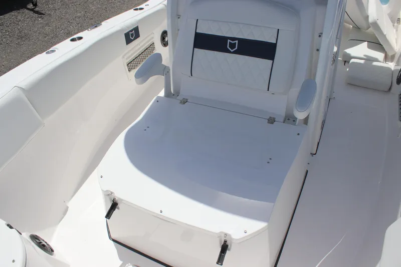 Slide: The Image of 2025 Sea Fox 268 Commander boat interior, featuring white seating and storage area. - 22