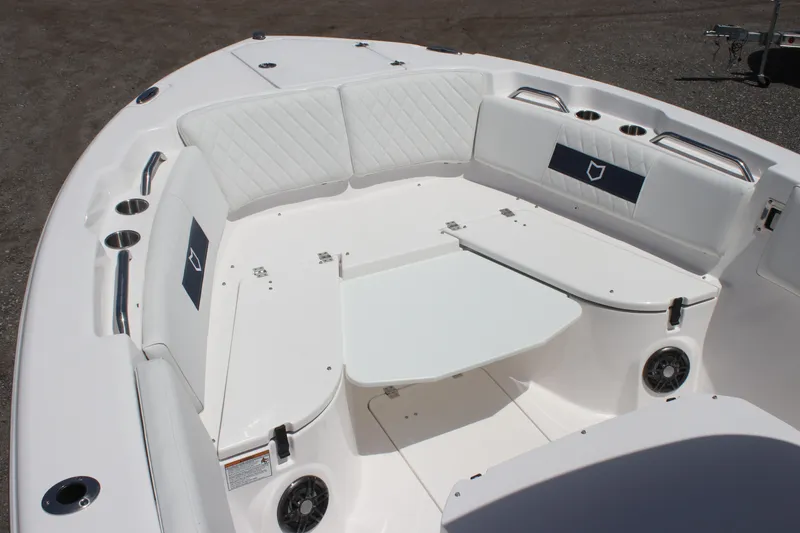 Slide: The Image of 2025 Sea Fox 268 Commander boat interior with white seating and table. - 24
