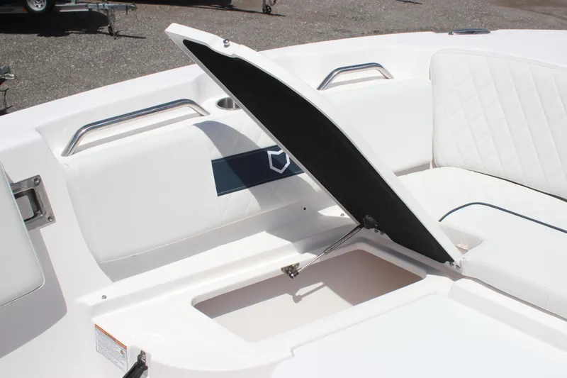 Slide: The Image of 2025 Sea Fox 268 Commander boat with open storage compartment and cushioned seating. - 25