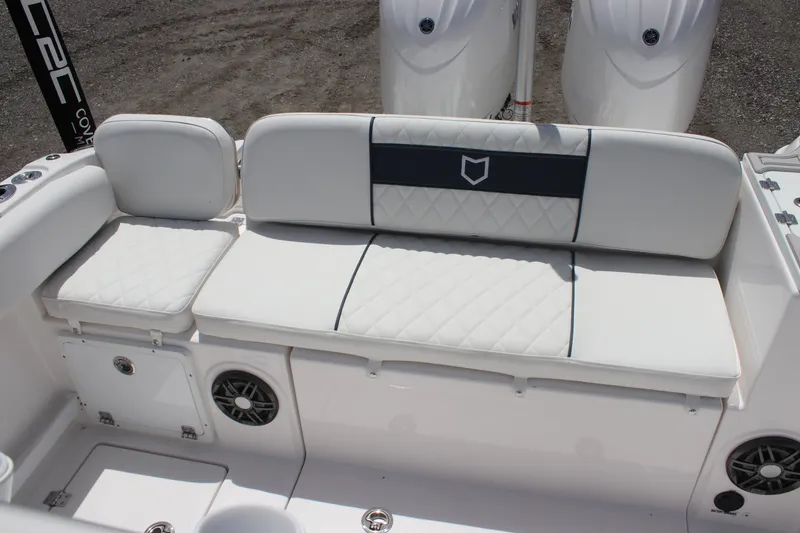 Slide: The Image of 2025 Sea Fox 268 Commander boat seating with white upholstery and built-in speakers. - 28