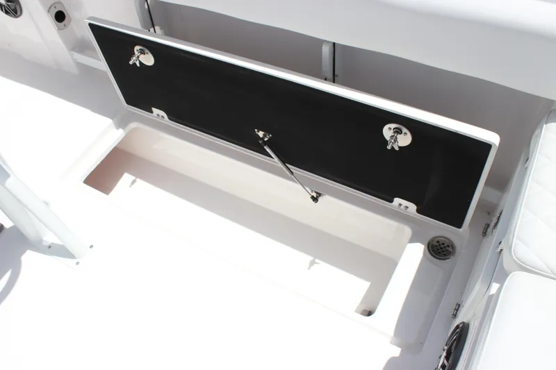 Slide: The Image of 2025 Sea Fox 268 Commander storage compartment with open hatch and secure locks. - 30