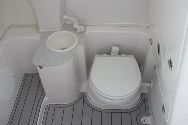 Slide: The Image of 2025 Sea Fox 268 Commander boat bathroom with sink and toilet. - 31