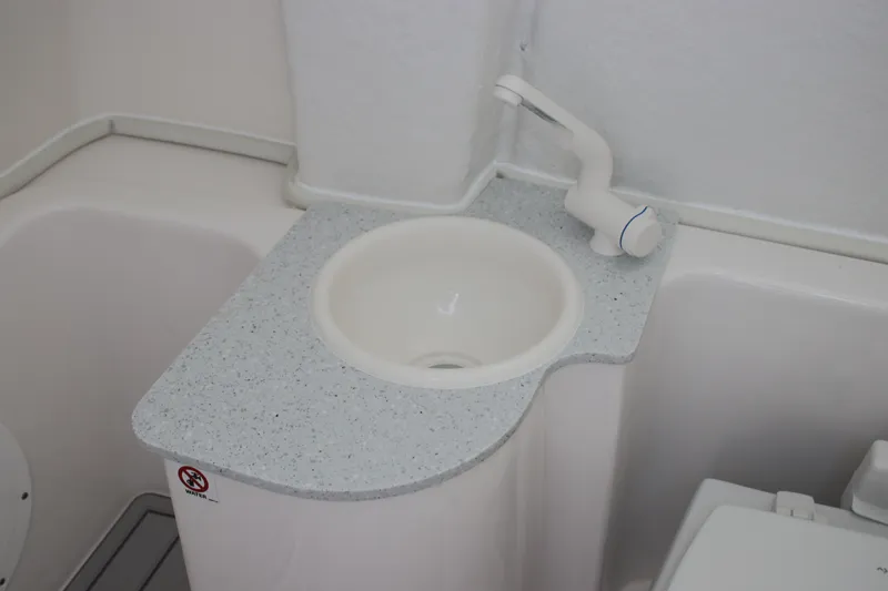 Slide: The Image of 2025 Sea Fox 268 Commander boat bathroom sink with modern faucet and countertop. - 32