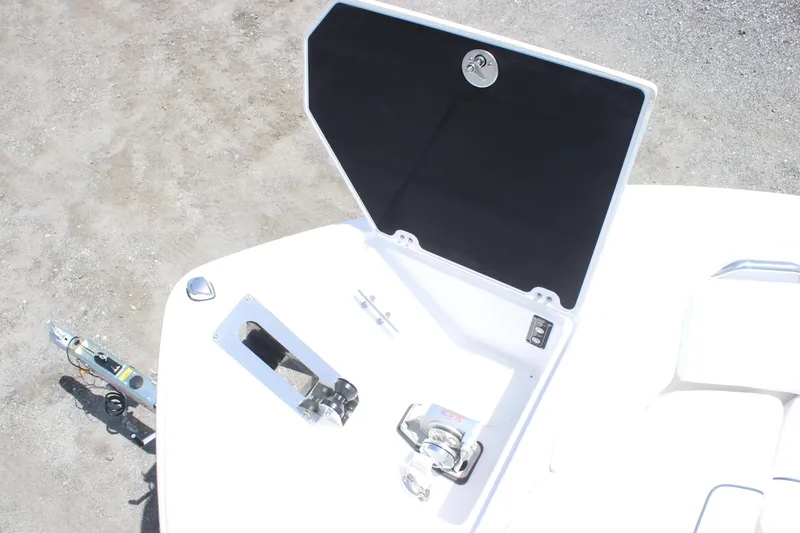 Slide: The Image of 2025 Sea Fox 268 Commander boat anchor compartment with open hatch, showcasing sleek design. - 33
