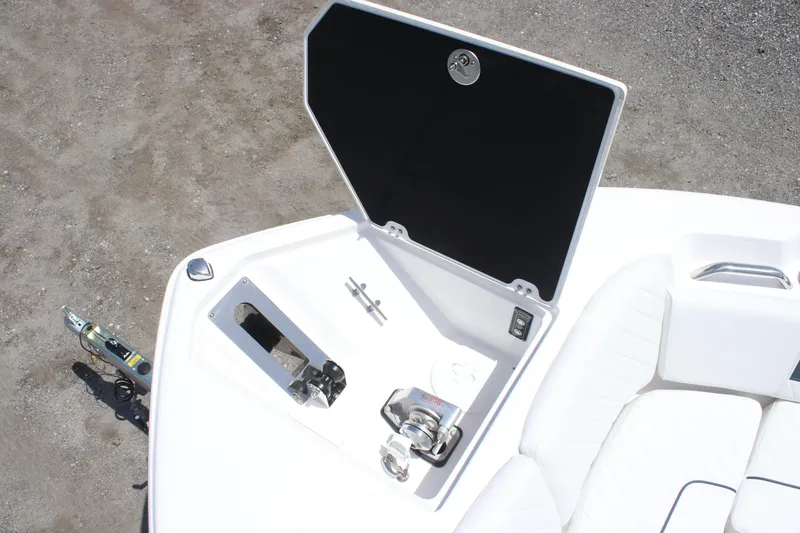 Slide: The Image of 2025 Sea Fox 268 Commander boat anchor compartment with open hatch, showcasing storage and winch. - 34