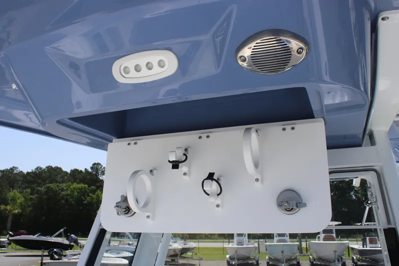Slide: The Image of 2025 Sea Fox 268 Commander boat console with mounted equipment and blue canopy. - 39