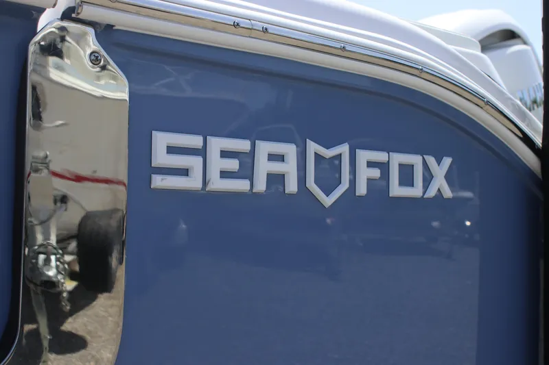 Slide: The Image of 2025 Sea Fox 268 Commander boat logo on blue hull. - 5