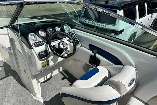 Slide: The Image of 2007 Chaparral SSX 236 boat cockpit with steering wheel and dashboard controls. - 11