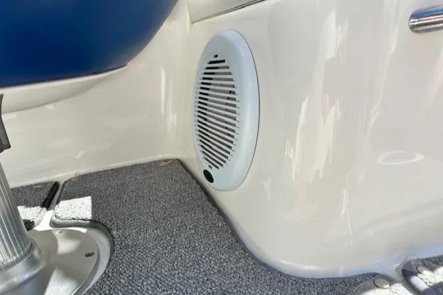 Slide: The Image of 2007 Chaparral SSX 236 boat interior with speaker and carpeted floor. - 13