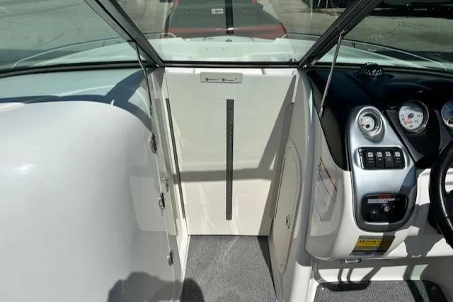 Slide: The Image of 2007 Chaparral SSX 236 boat interior, featuring dashboard controls and steering wheel. - 16