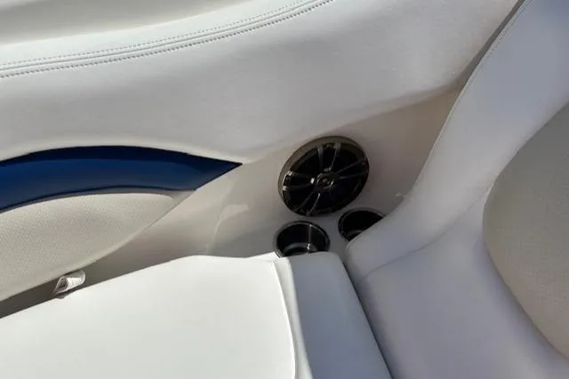 Slide: The Image of 2007 Chaparral SSX 236 boat interior with white seating and speaker detail. - 21