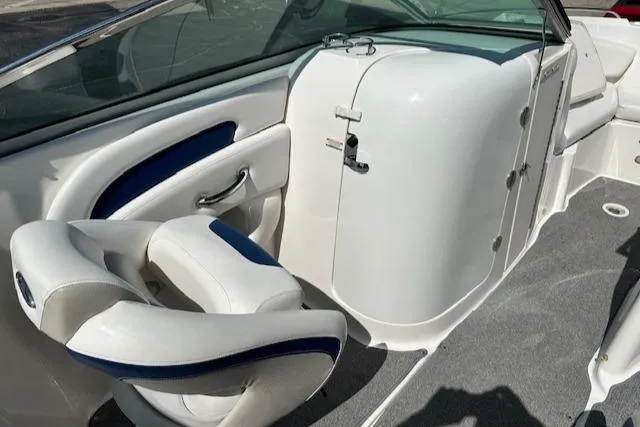 Slide: The Image of 2007 Chaparral SSX 236 boat interior with white and blue seating. - 23
