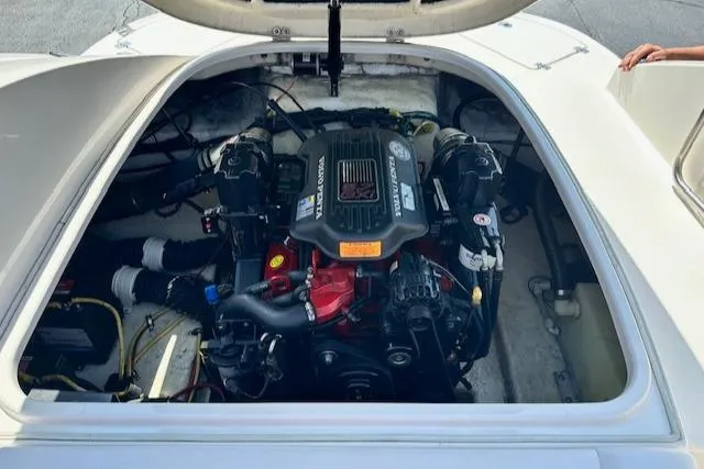 Slide: The Image of Engine compartment of a 2007 Chaparral SSX 236 boat, showcasing the motor and components. - 29