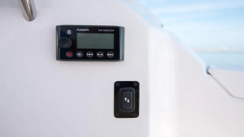 Slide: The Image of Control panel on 2026 Regal 33 XO boat, featuring Fusion MS-NRX300. - 12