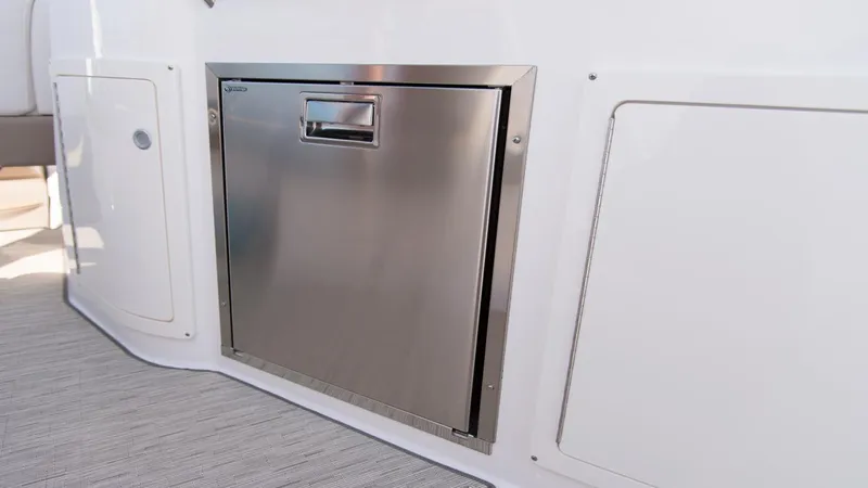 Slide: The Image of Stainless steel appliance on 2026 Regal 33 XO boat interior. - 13