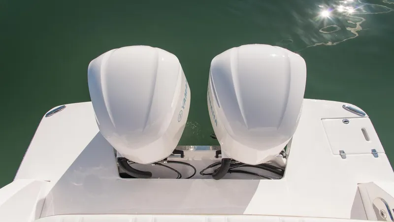Slide: The Image of Twin outboard engines on a 2026 Regal 33 XO boat, viewed from above. - 15