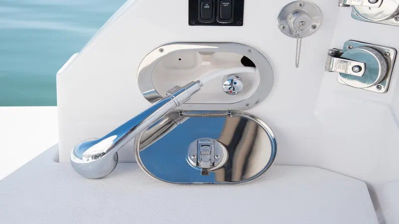 Slide: The Image of 2026 Regal 33 XO boat control panel with chrome lever and switches. - 17