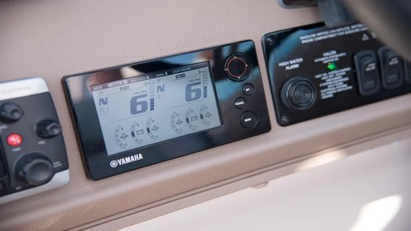 Slide: The Image of Dashboard of 2026 Regal 33 XO boat featuring Yamaha display and controls. - 28