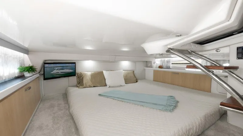 Slide: The Image of Luxurious interior of 2026 Regal 33 XO yacht with cozy bed and modern decor. - 37
