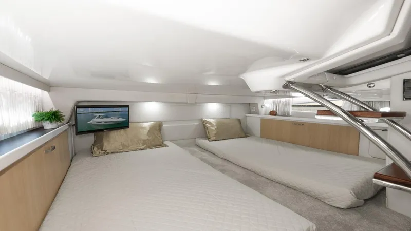 Slide: The Image of Luxurious interior of 2026 Regal 33 XO yacht with twin beds and modern decor. - 38