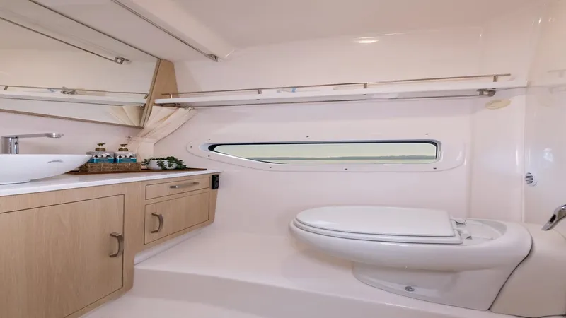 Slide: The Image of Luxurious bathroom in 2026 Regal 33 XO yacht with modern fixtures and sleek design. - 40