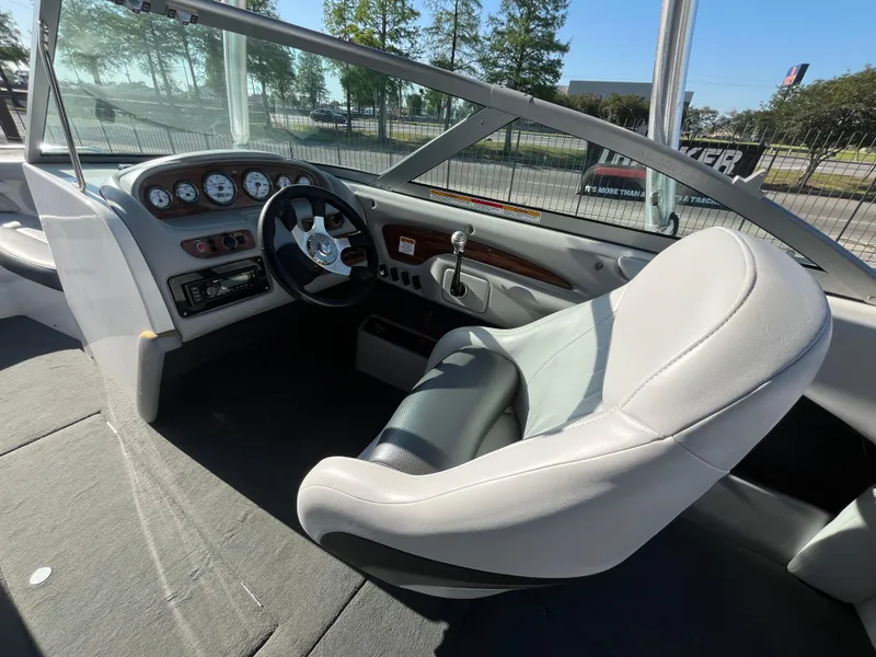Slide: The Image of 2004 MasterCraft 210 Maristar boat interior with steering wheel and dashboard. - 14