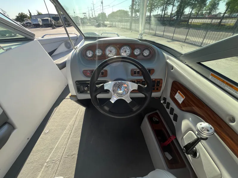 Slide: The Image of 2004 MasterCraft 210 Maristar boat dashboard with steering wheel and gauges. - 15