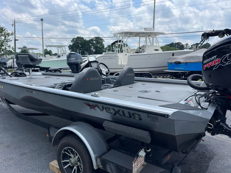 Slide: The Image of 2022 Vexus AVX189 boat on trailer, featuring sleek design and Mercury Pro XS engine. - 1
