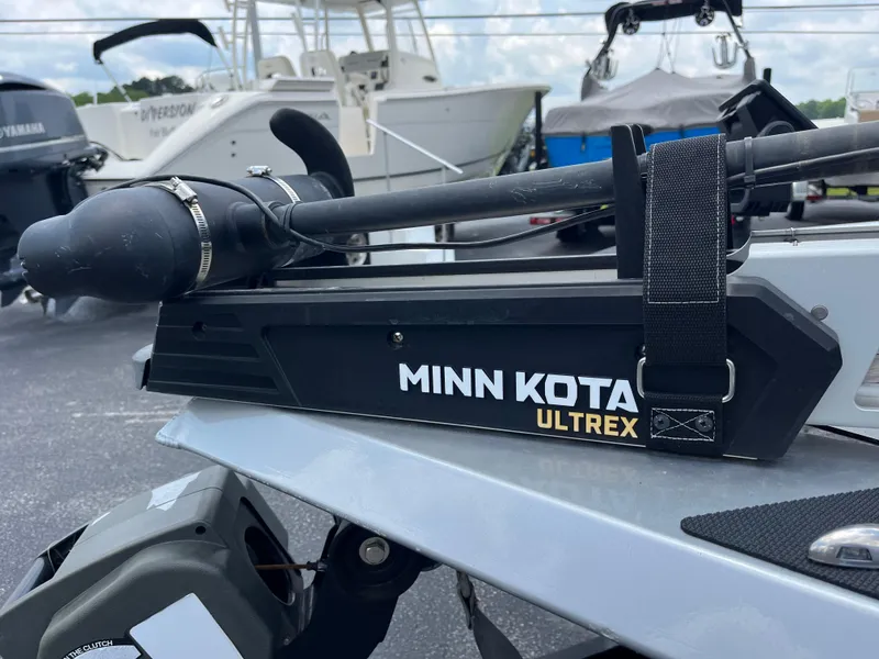Slide: The Image of Minn Kota Ultrex motor on 2022 Vexus AVX189 boat, parked in a marina. - 10