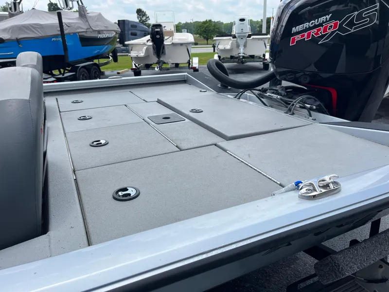 Slide: The Image of 2022 Vexus AVX189 boat deck with Mercury Pro XS engine, parked outdoors. - 12