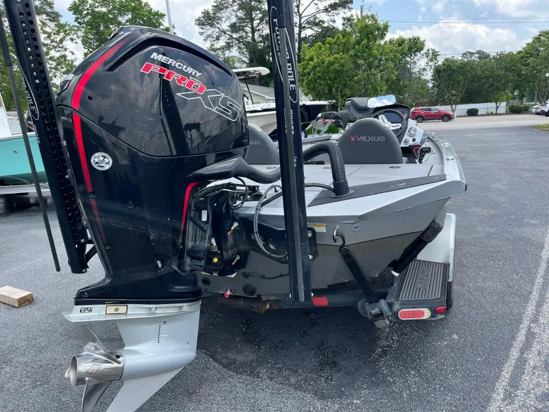 Slide: The Image of 2022 Vexus AVX189 boat with Mercury Pro XS engine, parked outdoors. - 7