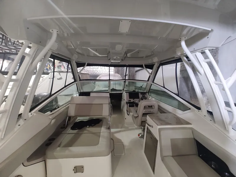 Slide: The Image of Interior view of 2021 Boston Whaler 280 Vantage boat, featuring seating and helm area. - 11