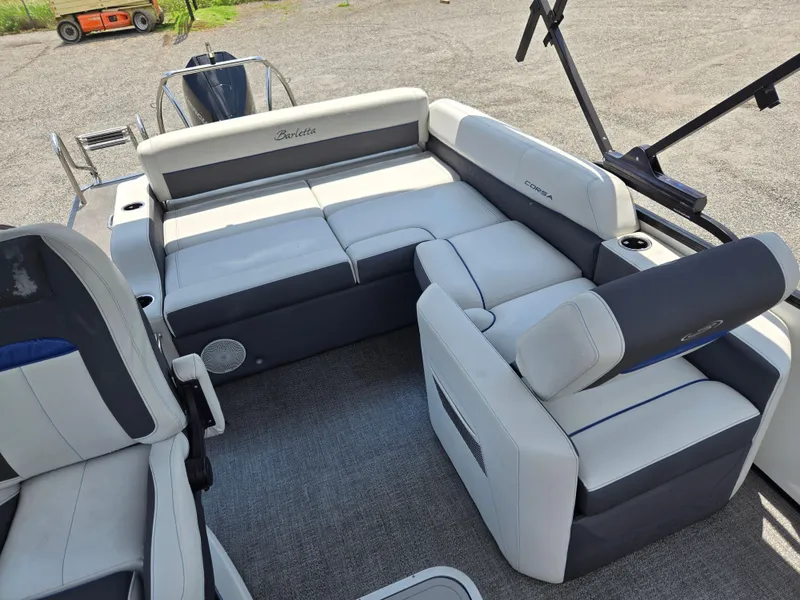 Slide: The Image of 2022 Barletta Corsa 23U boat interior with plush seating and modern design. - 14