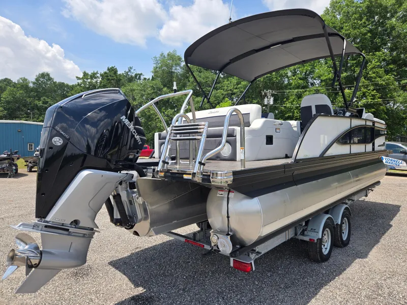 Slide: The Image of 2022 Barletta Corsa 23U pontoon boat with canopy and powerful outboard motor on trailer. - 20