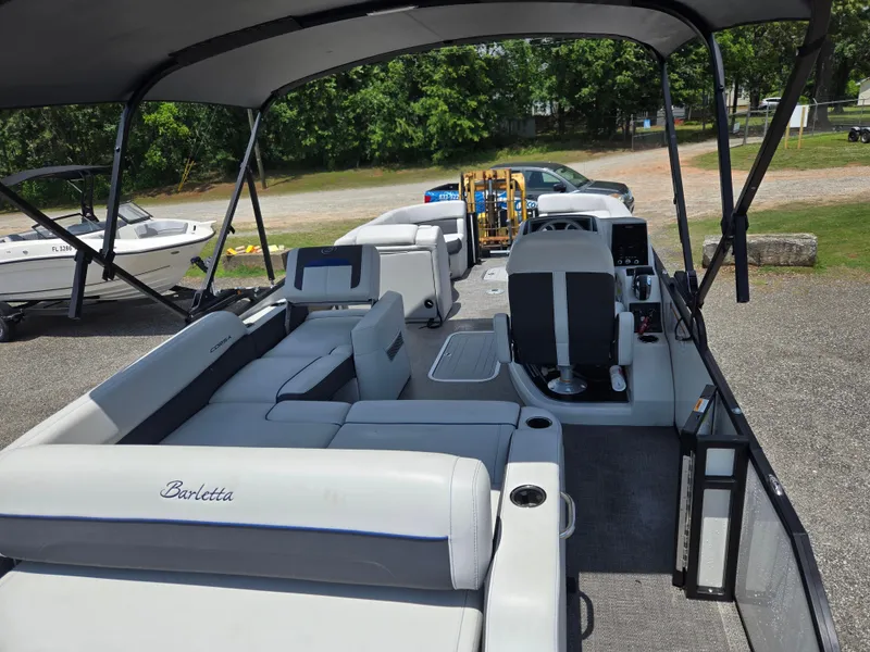 Slide: The Image of 2022 Barletta Corsa 23U pontoon boat with spacious seating and modern design. - 7