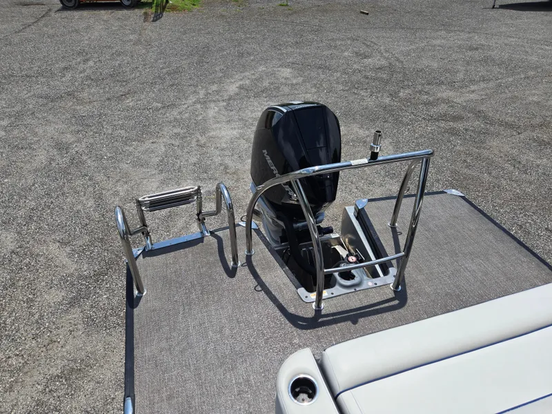 Slide: The Image of 2022 Barletta Corsa 23U boat with motor and swim ladder on deck. - 9