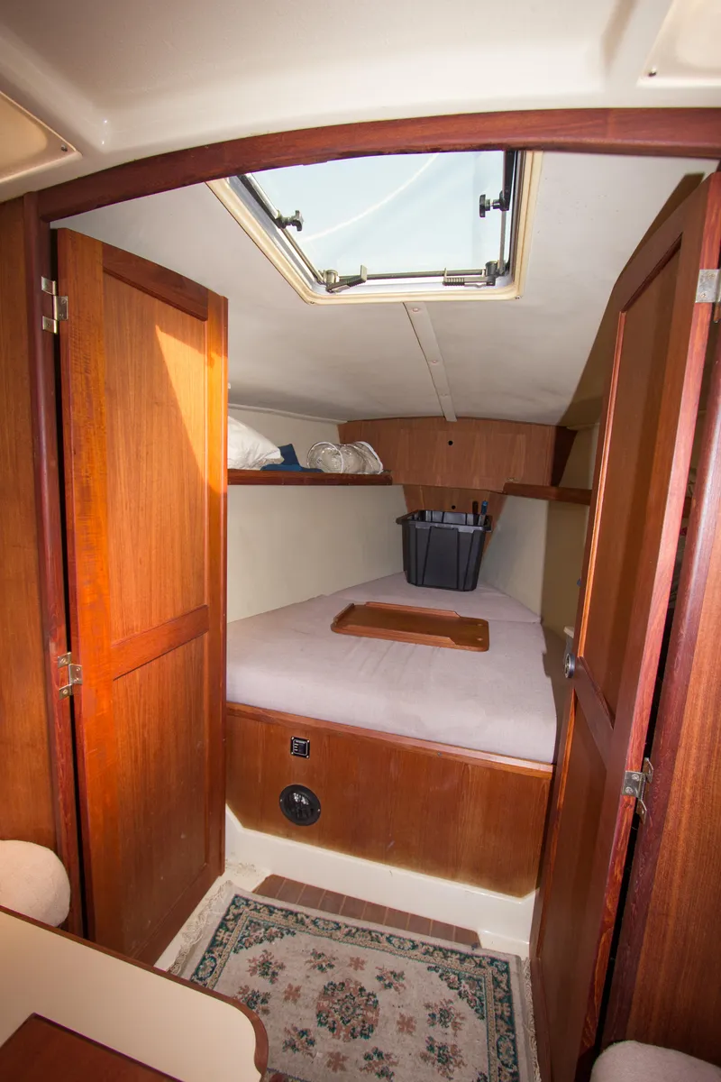 Slide: The Image of Interior cabin of 1989 Hunter 37.5 sloop with wooden doors and skylight. - 16
