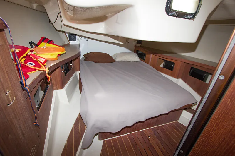 Slide: The Image of Interior cabin of 1989 Hunter 37.5 sloop with bed and wooden cabinetry. - 17
