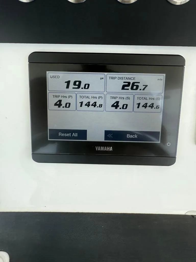 Slide: The Image of Yamaha display on 2023 Regulator 28 showing fuel usage and trip distance. - 10