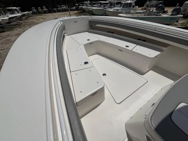 Slide: The Image of 2023 Regulator 28 boat with spacious seating and storage compartments. - 15