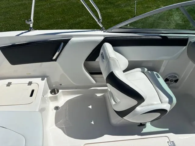 Slide: The Image of 2017 Chaparral 19 H20 Sport boat interior with white and black seating. - 11