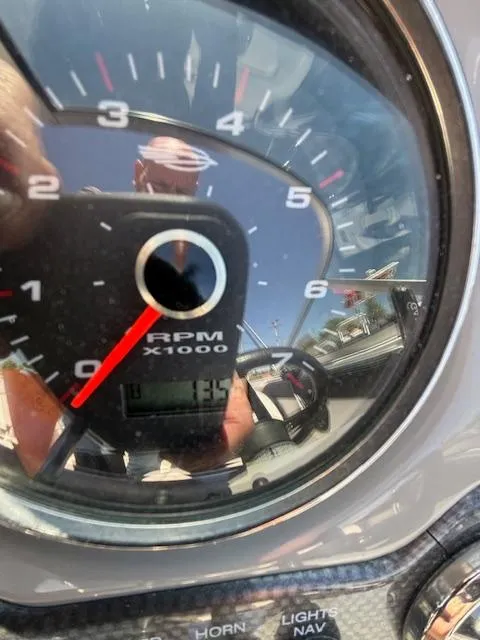 Slide: The Image of Close-up of 2017 Chaparral 19 H20 Sport tachometer showing RPM gauge and reflections. - 13